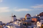 Set against the ethereal backdrop of the Aegean Sea, the town of Oia in Santorini paints a picture of Grecian allure. The dominant windmill, an emblem of the island’s history, stands proudly amidst the cascading whitewashed buildings.