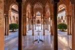 A captivating glimpse into the heart of Alhambra’s Nasrid Palace, embodying tranquility and architectural brilliance.