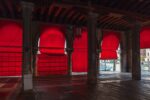 Immerse yourself in the calming yet vibrant ambiance of Venice, beautifully captured through the red hues of a picturesque warehouse that embodies tranquility and style.