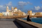 This striking image portrays a solitary figure amidst the historic beauty of Cadiz, offering a tale of reflection and timelessness.