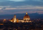 Evening view of Florence Duomo with city lights.