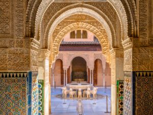 Detail-rich archways of Alhambra Palace with Moorish designs.