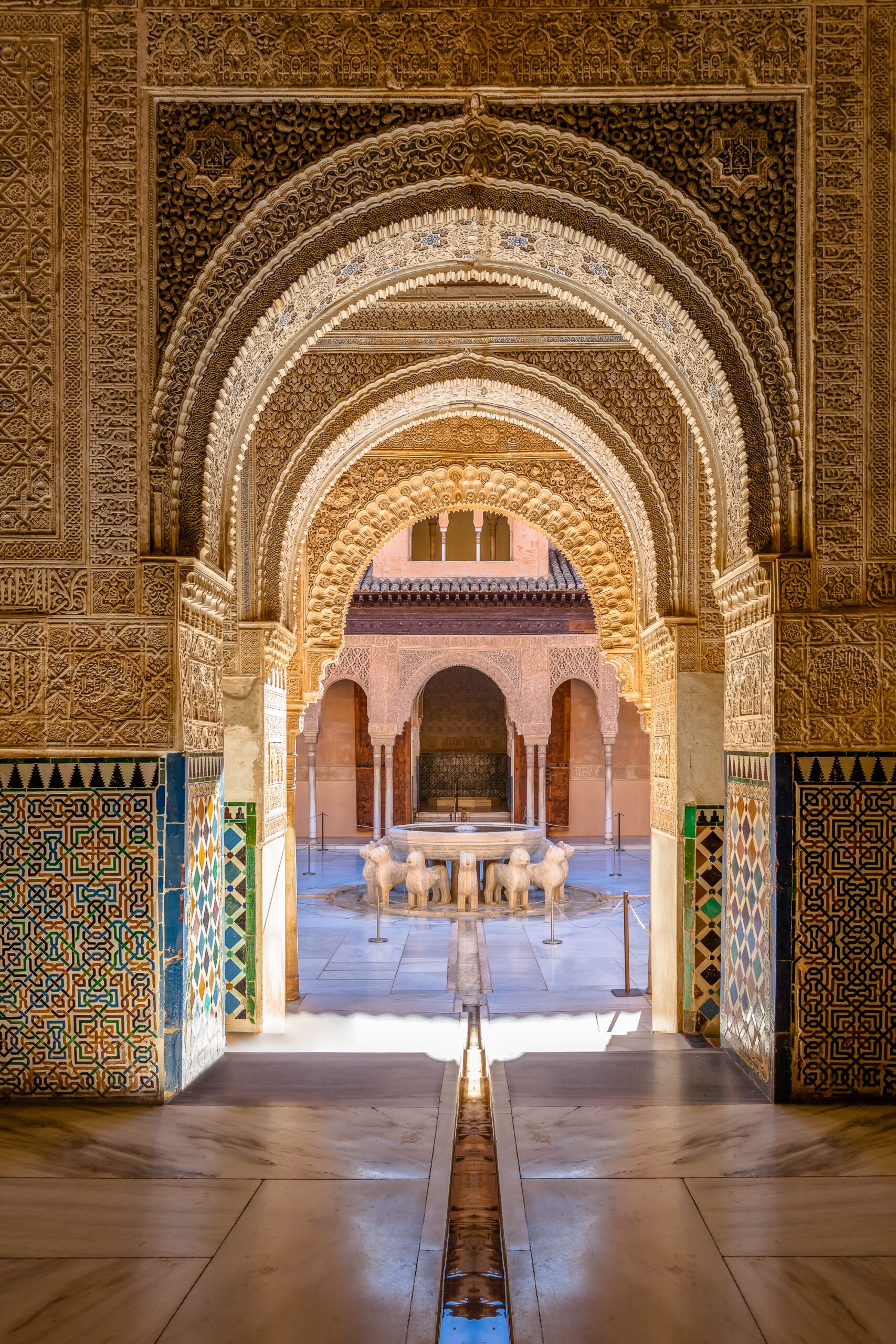 Detail-rich archways of Alhambra Palace with Moorish designs.