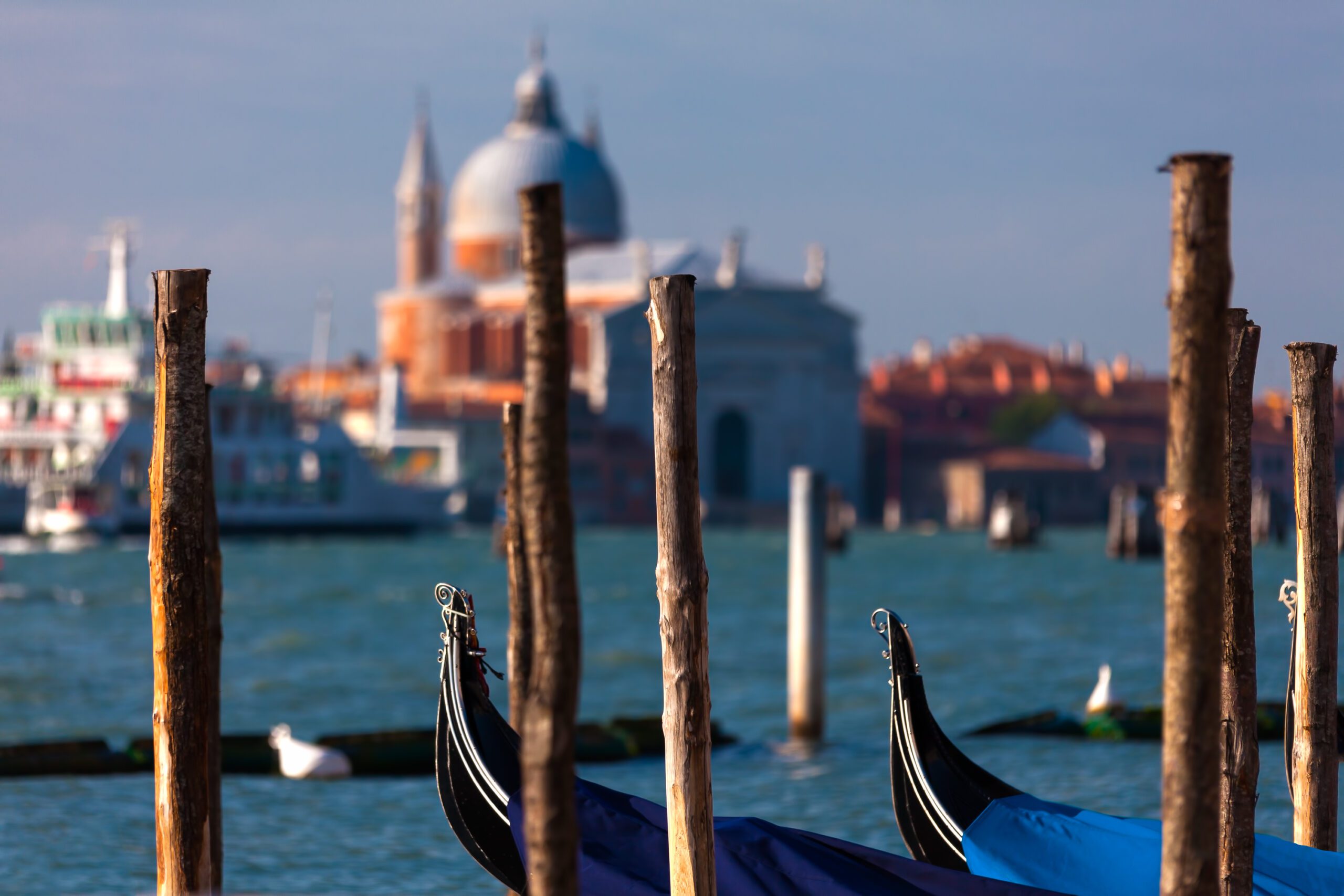 Venetian gondola with historic basilicas in background