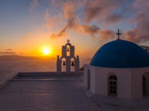 Santorini chapel at sunset with ocean view