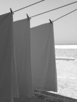 Monochrome photo of hanging linens in Fira, Santorini