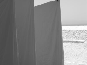 Monochrome photo of hanging linens in Fira, Santorini