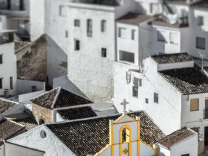 Aerial view of whitewashed buildings in Setenil de las Bodegas, Spain.