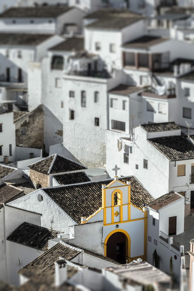 Aerial view of whitewashed buildings in Setenil de las Bodegas, Spain.