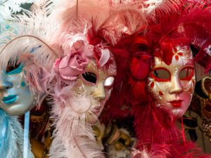 Close-up of colorful Venetian masquerade masks with intricate designs