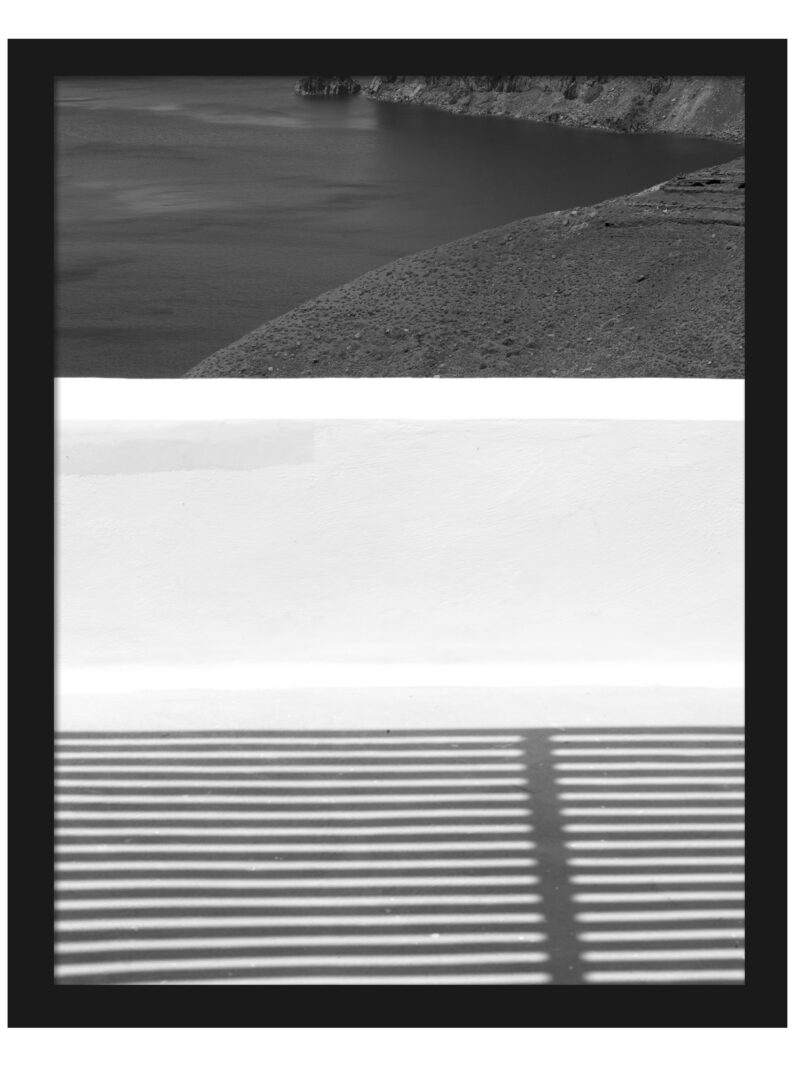 Dramatic geometric shadows cast across a balcony in Santorini, Greece.