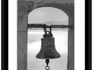 Ancient bell in black and white, overlooking the caldera in Santorini, Greece.