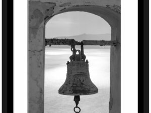 Ancient bell in black and white, overlooking the caldera in Santorini, Greece.