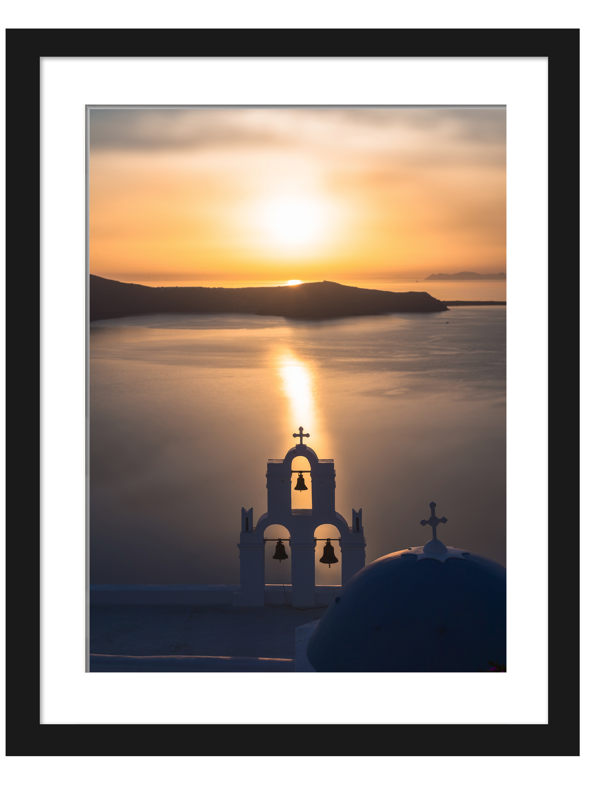 Church bells silhouette against a golden sunset in Santorini, Greece.